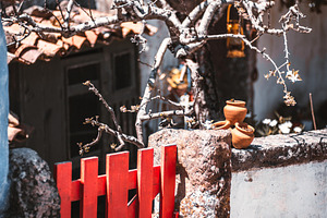 Red gate and rustic stone wall, an Architecture Photo by SkyNext