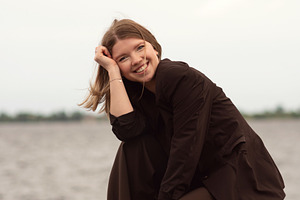 Smiling woman in brown suit, a Person Photo by Elena Vagengeim