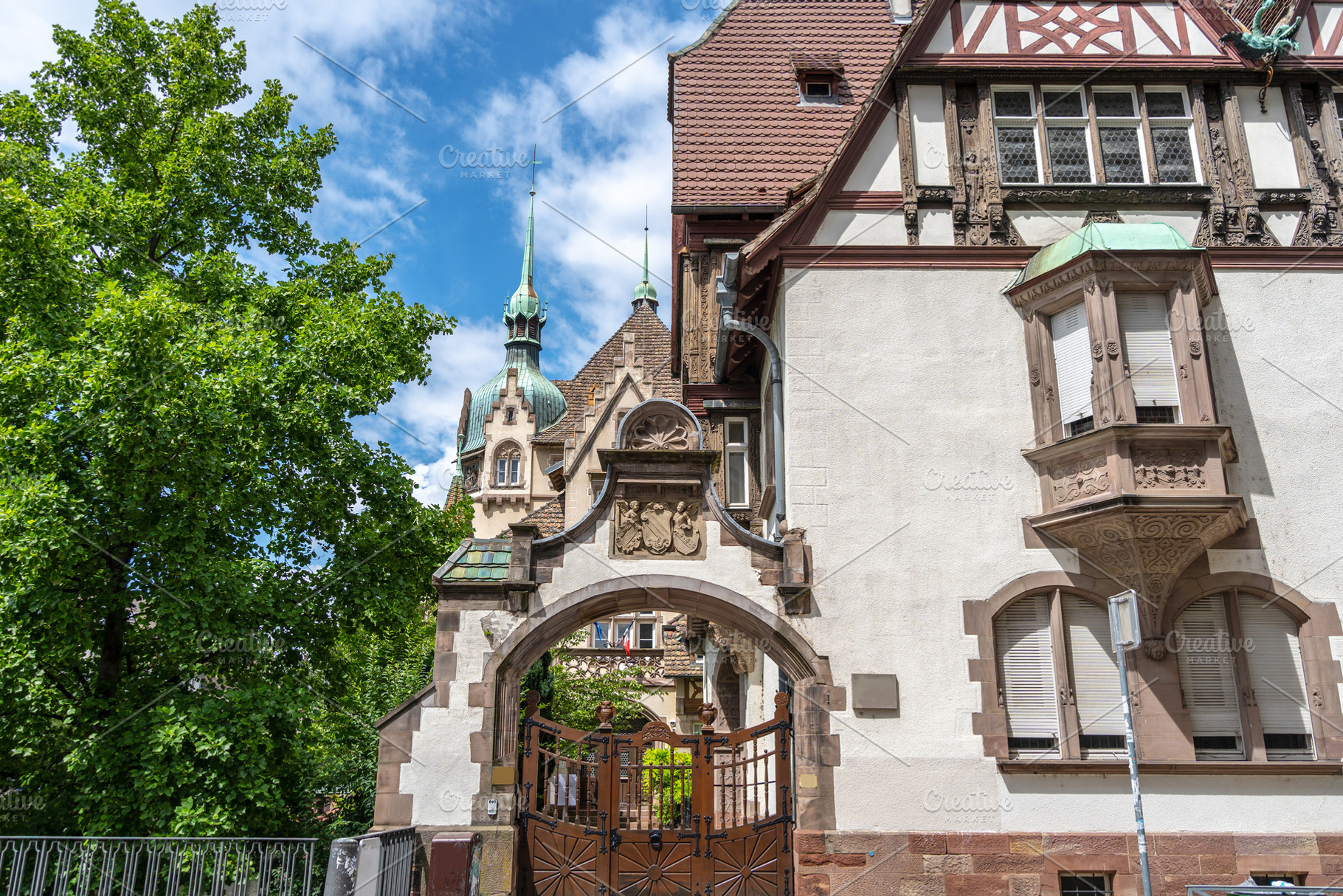 Historic building with ornate gate in Strasbourg, an Architecture Photo by GoodGoods