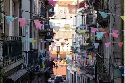 Colorful flags on street of old city, an Architecture Photo by Barcelona_dreams