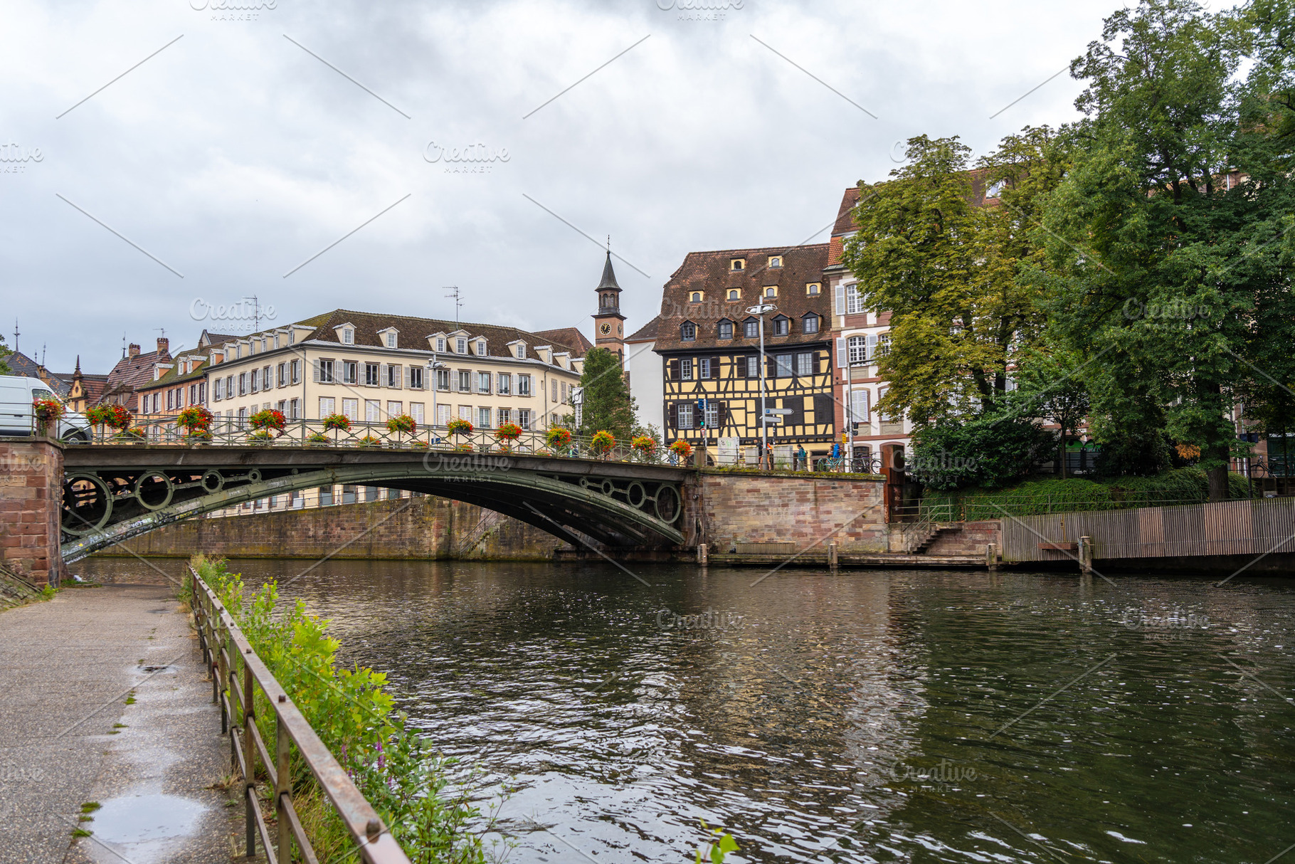 Iron bridge and colorful houses on the Ill river Strasbourg, Fra, an Architecture Photo by GoodGoods