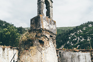 Ruined bell tower in mountain, an Architecture Photo by SkyNext