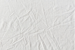 Natural crumpled white linen textile, an Abstract Photo by Yaroslav Danylchenko