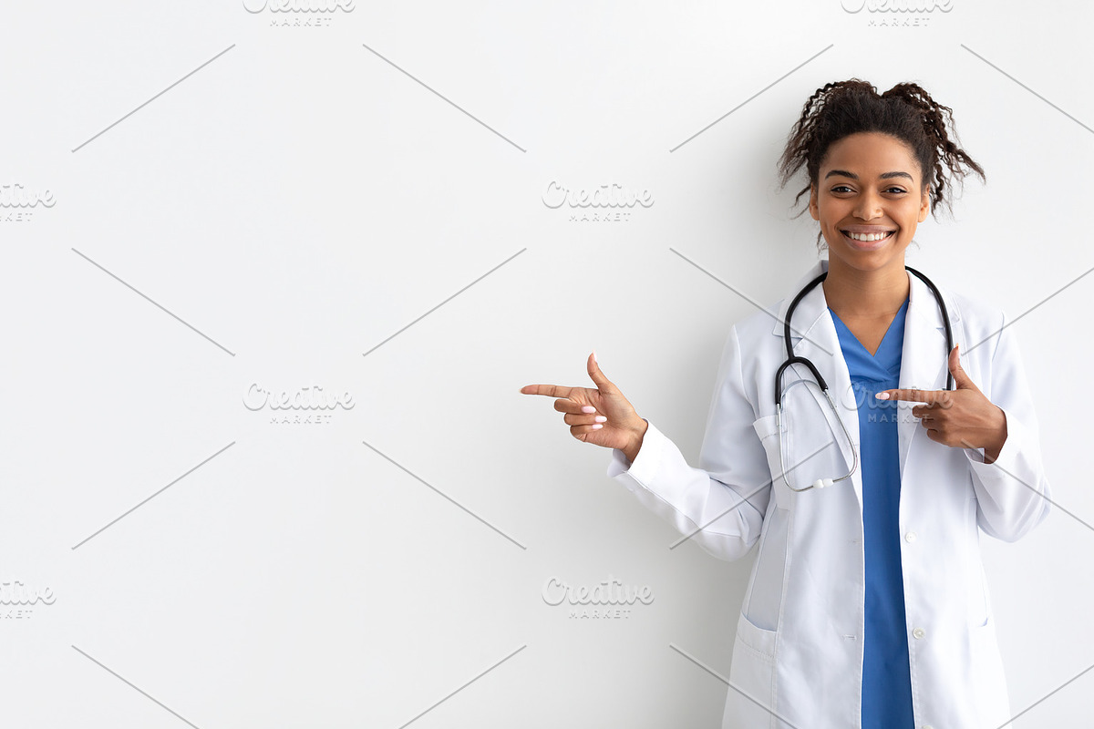 Portrait of black doctor smiling and posing to camera, a Photo by Prostock-Studio (Photo 2 of 2)