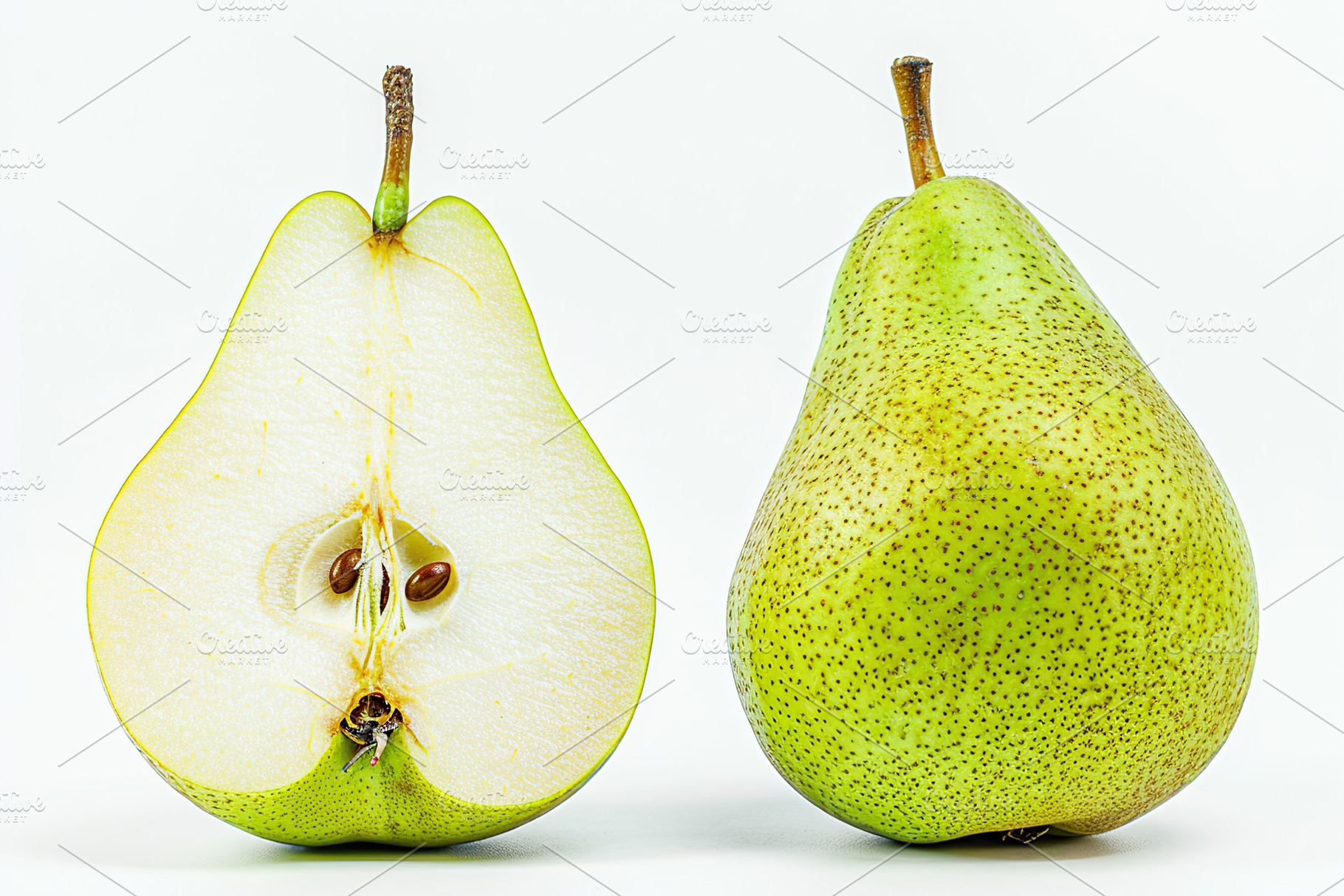 Green pear and pear half isolated on white background, a Food & Drink Photo by AlyaAnd