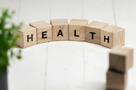 Six wooden cubes, blocks standing on table and showing word HEALTH. Conceptual, a Business Photo by Volodymyr Melnyk