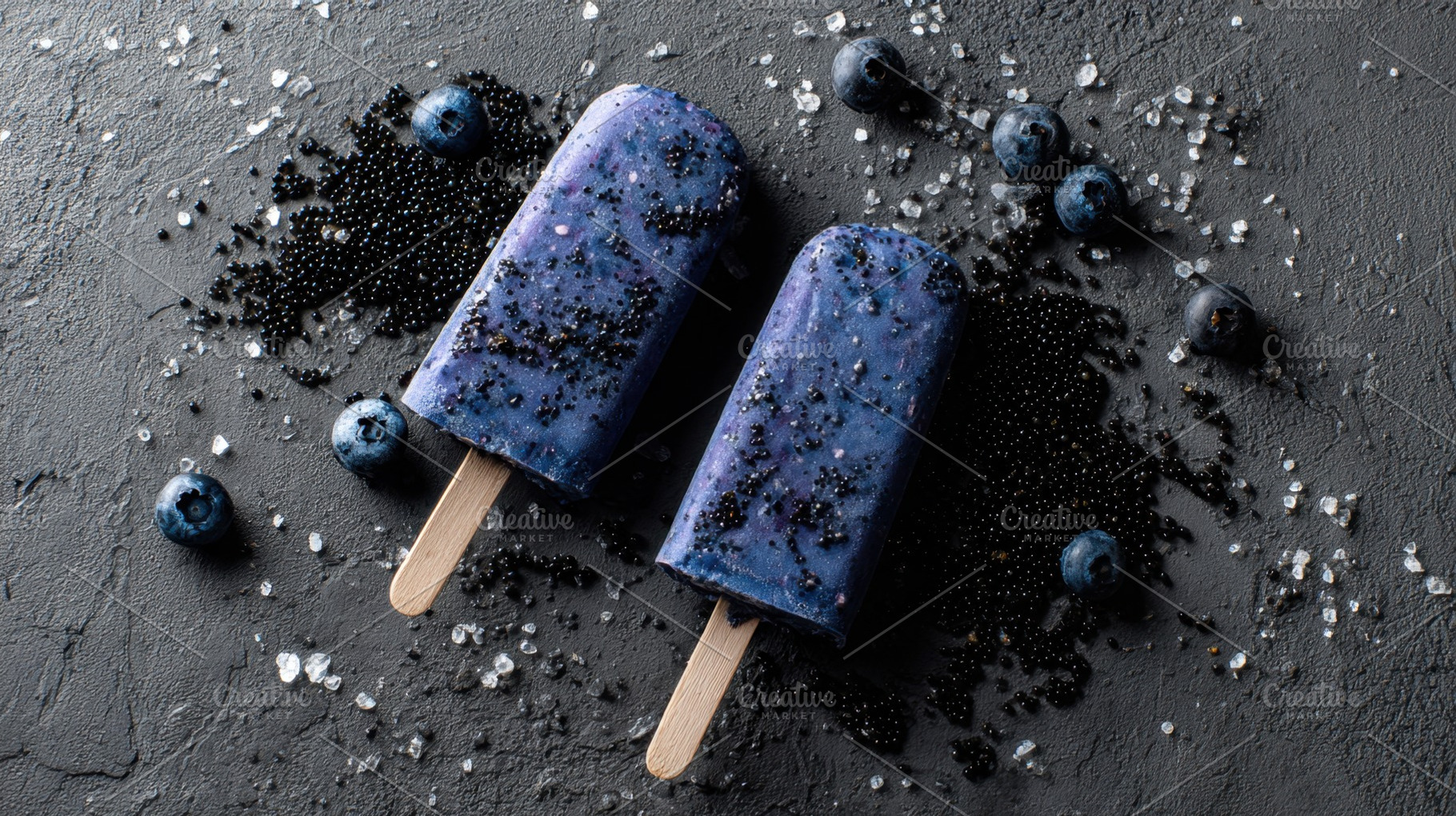 Blueberry pops on dark stone, a Photo by Beautiful things