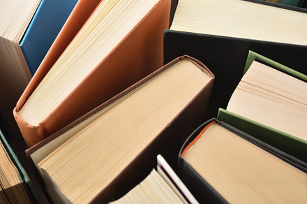 Detail of the top edge of books with multi-colored covers