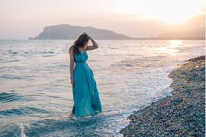 Woman in Flowing Dress on Seaside, a Person Photo by Jan Jack Russo Media