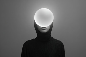 Person with glowing sphere on head, a Photo by Beautiful things