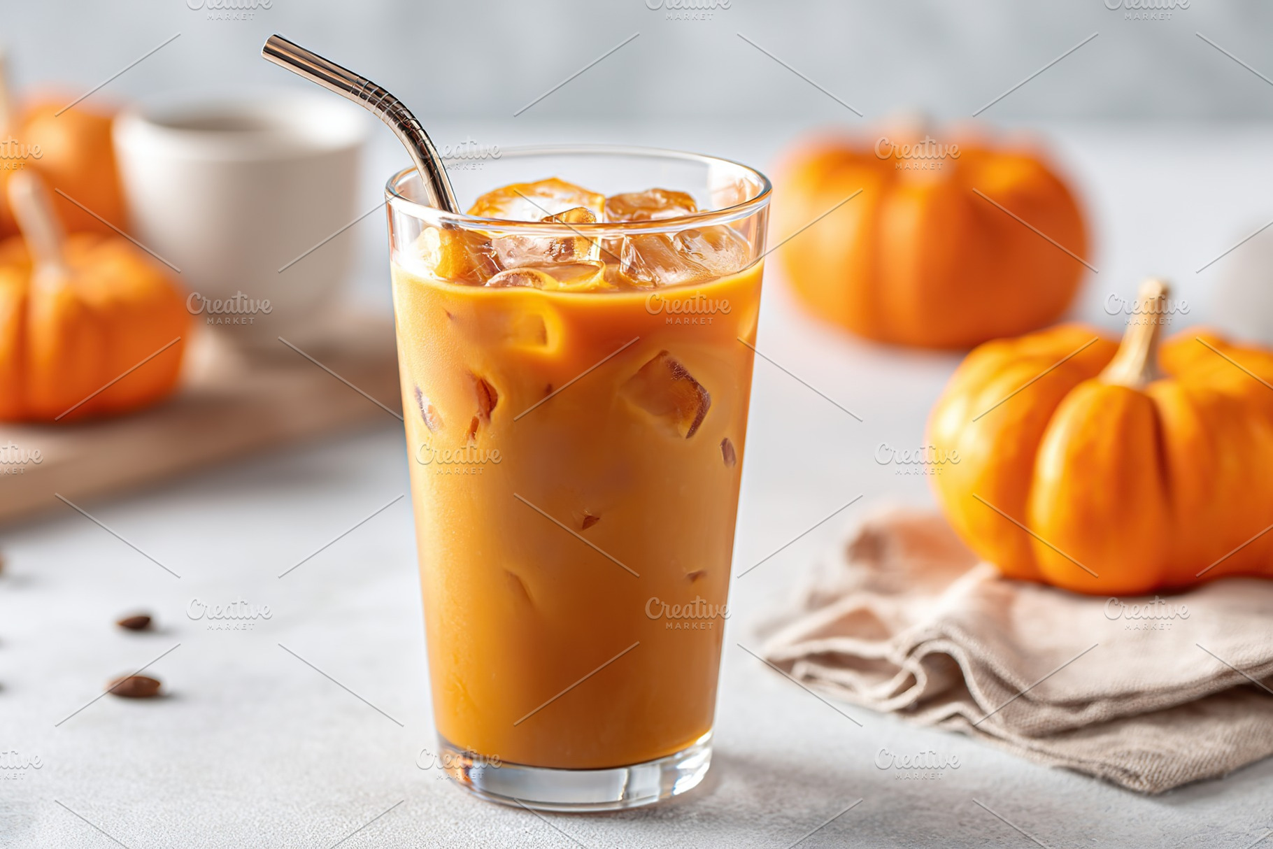 Pumpkin spice iced coffee with autumn decor and cozy ambiance, a Photo by AlyaAnd