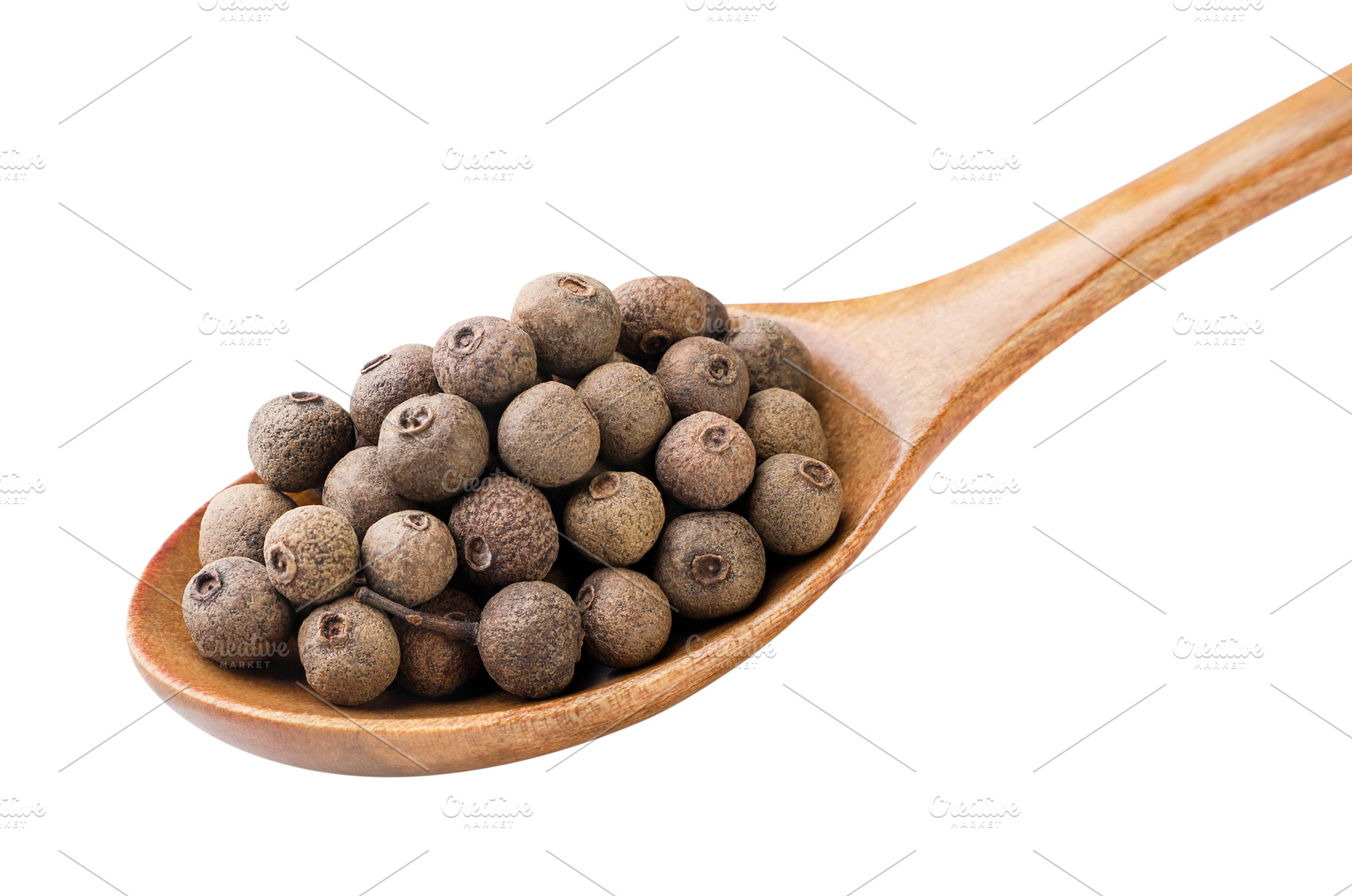 Allspice peas in a wooden spoon, a Food & Drink Photo by innakreativ