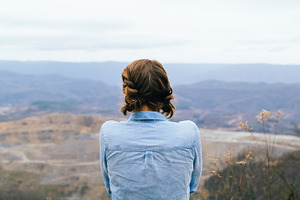 Perspective containing girl, mountains, and nature