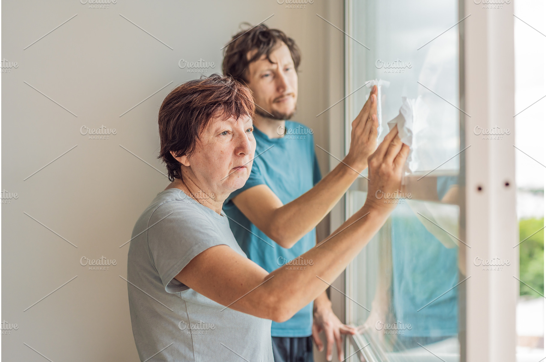 Older woman and her adult son, a Person Photo by Elizaveta Galitskaya