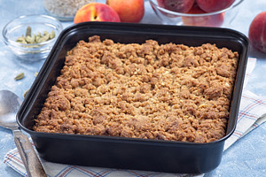 Delicious Peach Crisp or cobbler with brown sugar and oat streusel in backing d, a Food & Drink Photo by iuliia_n