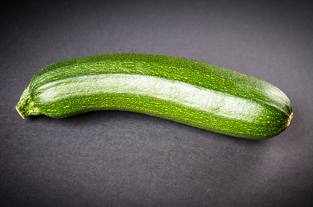 Zucchini isolated on a black background, a Food & Drink Photo by GoodGoods
