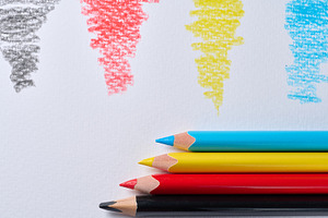 Four colored pencils lying on white paper, with a stroke of the, a School & Education Photo by ndanko