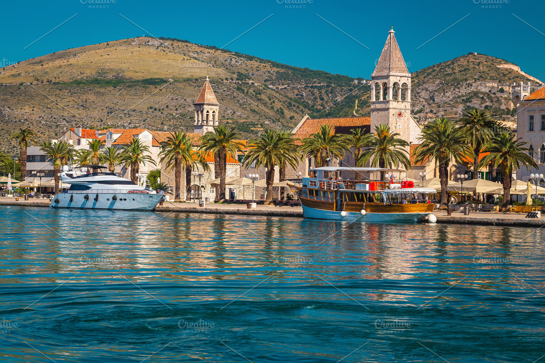 Moored ships and waterfront walkway, an Architecture Photo by Alpine Dreams