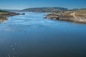 River flowing through dry valley, a Nature Photo by DanFLCreativo