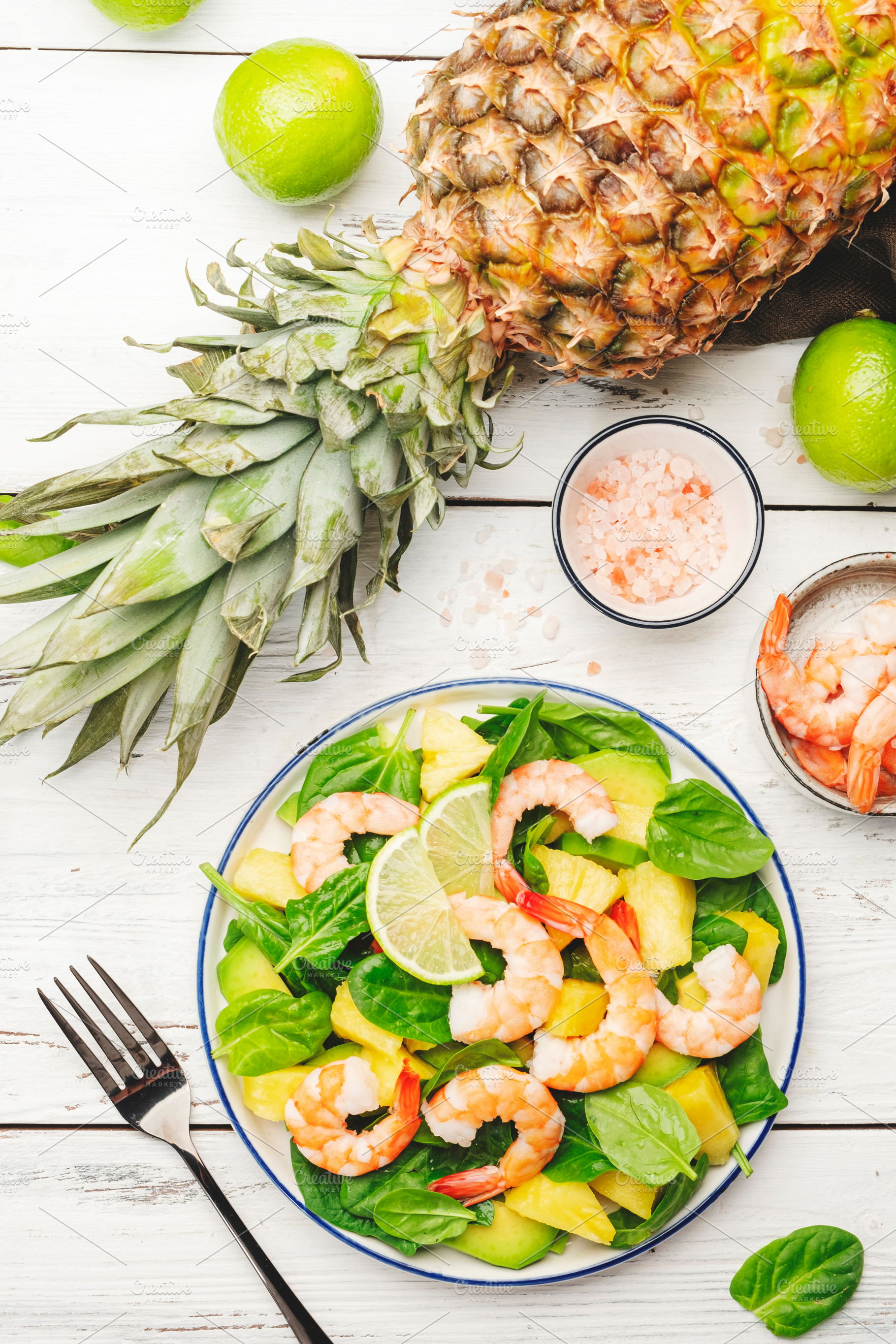 Pineapple shrimp salad with spinach, avocado and lime on white w, a Food & Drink Photo by 5PH