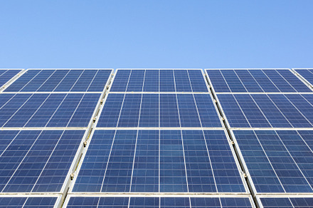 Solar Panels Against Blue Sky, a Background Photo by Formatoriginal photo