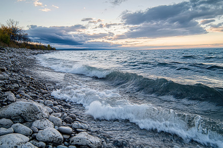 Waves Crash Against Rocky Shore at S, a Photo by Tanuart