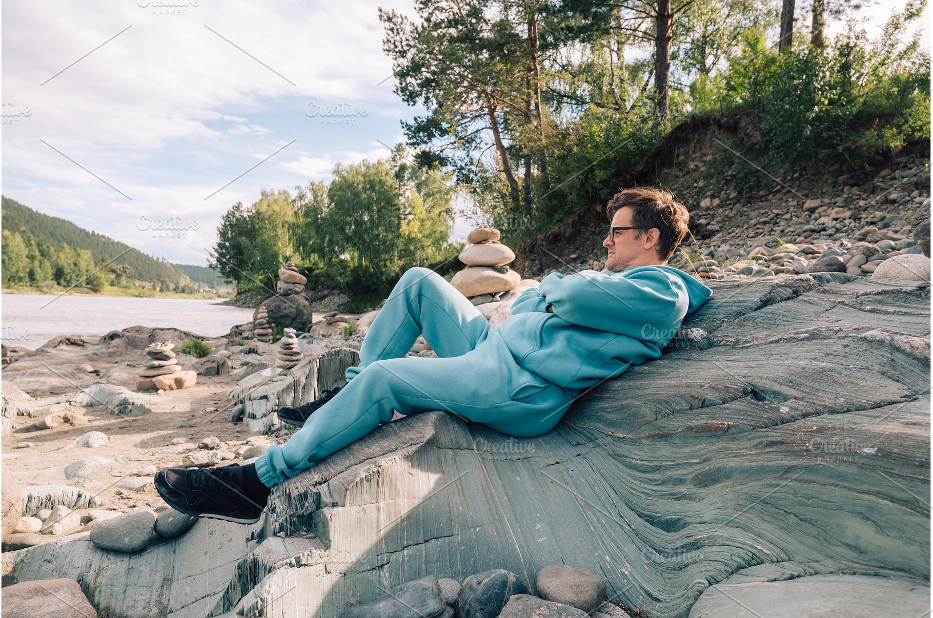 Man at the river Katun at summer day, a Person Photo by Jan Jack Russo Media