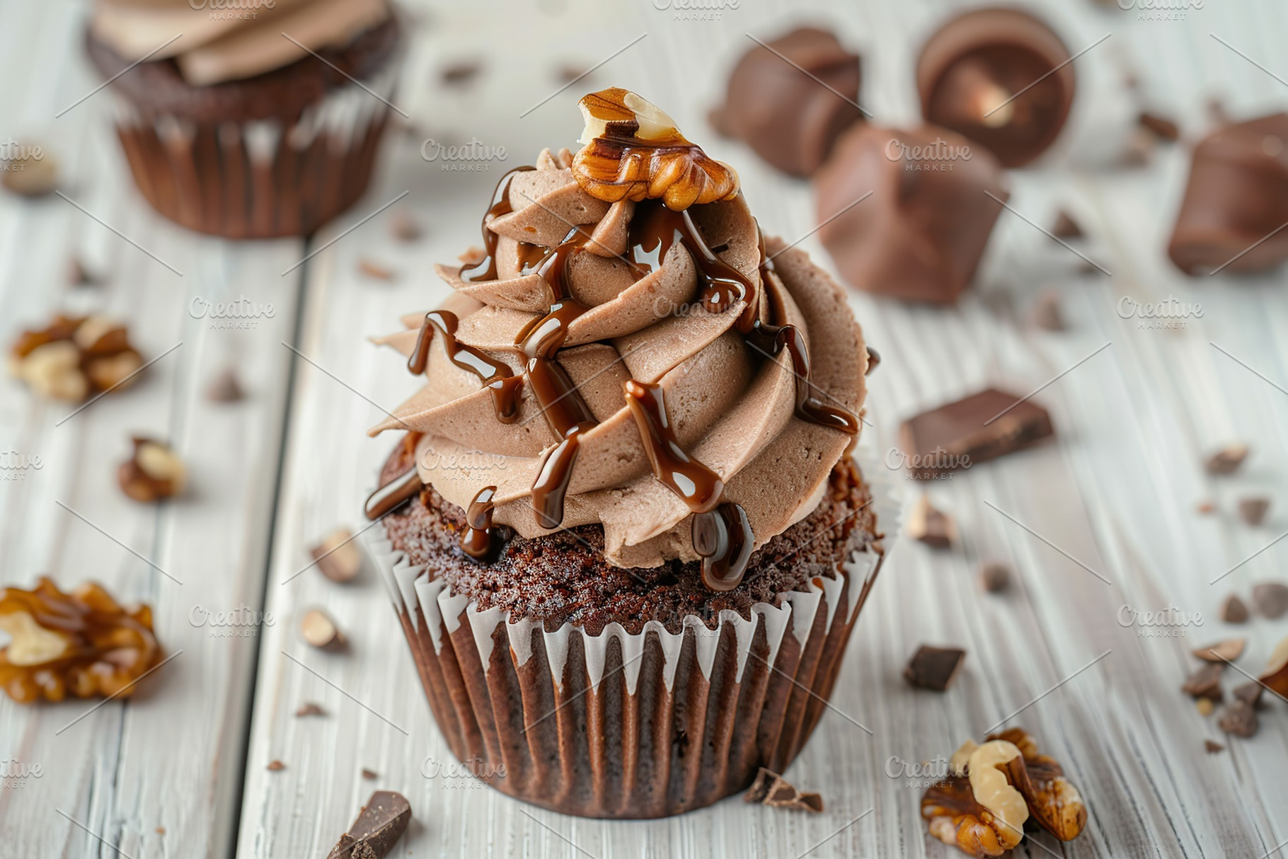 Chocolate cupcake with whipped cream and walnut on wooden table, a Food & Drink Photo by AlyaAnd
