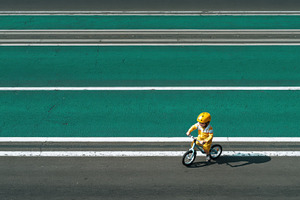 Child rides bicycle on the road, a Photo by Beautiful things