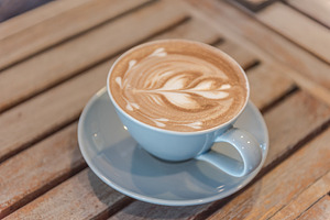 Close up  latte coffee containing aroma, art, and background