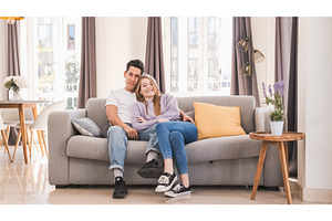 Portrait of young couple smiling and