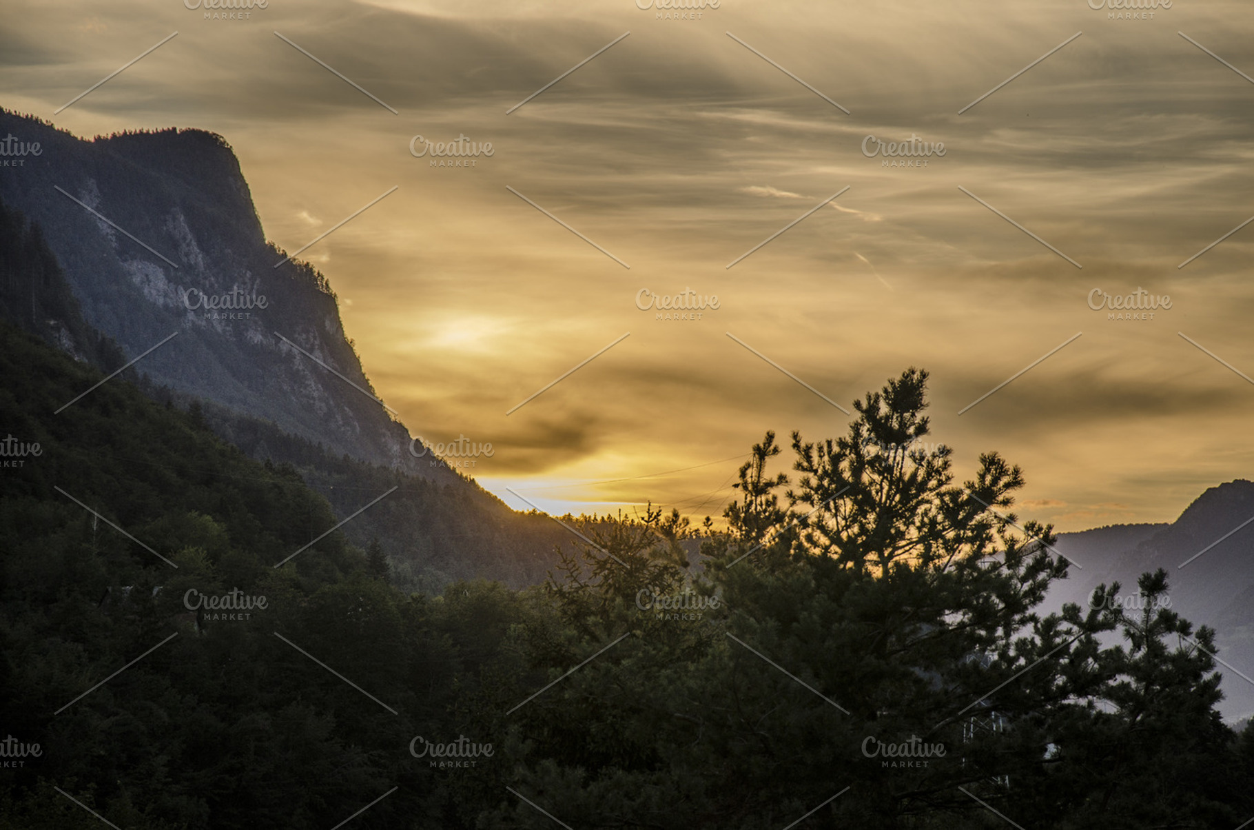 Sunset In The Mountains Stock Photo Containing Mountains And Sky