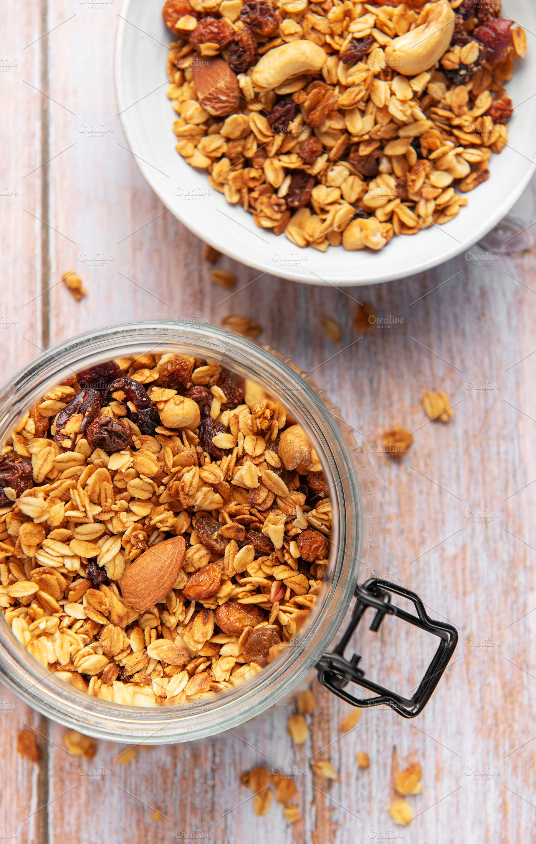 Granola cereal in glass jar, healthy breakfast concept, a Food & Drink Photo by Olena Rudo