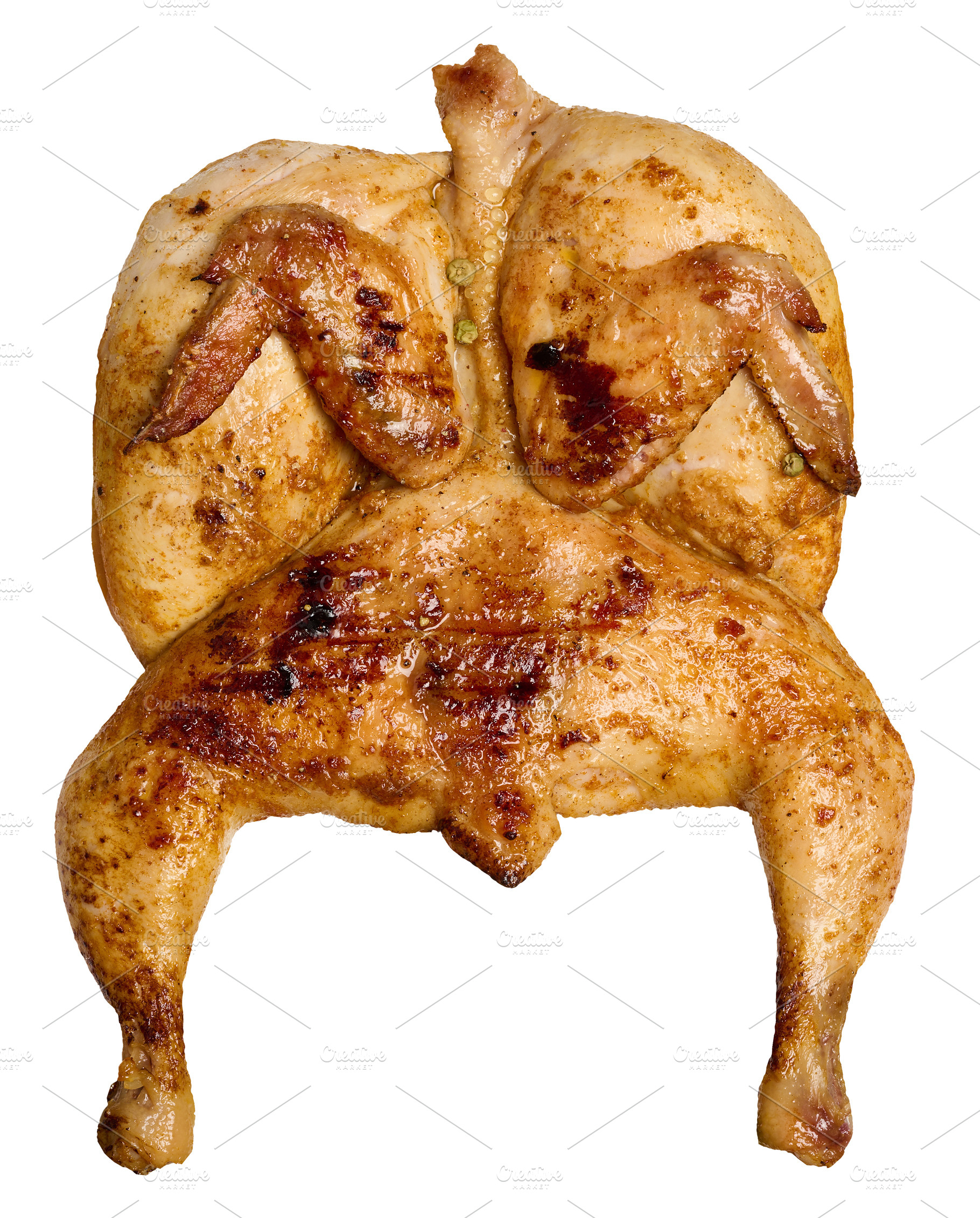 Whole grilled chicken marinated with spices on an isolated backg, a Food & Drink Photo by ndanko