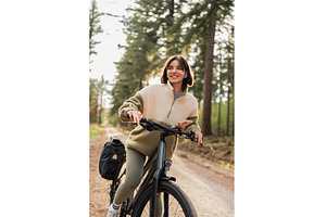 Fit traveler rides a bike along, a Nature Photo by AD Stock Images