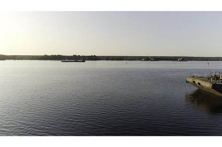 Cargo barge moored by the river, an Industrial Photo by Media Whale Stock