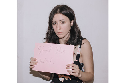 Sad young woman holding a blank, a Person Photo by zheckasmk