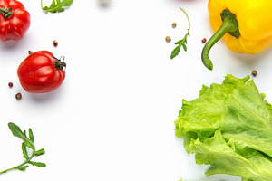 Fresh colorful vegetables and olive oil creating a healthy borde, a Food & Drink Photo by Olena Rudo