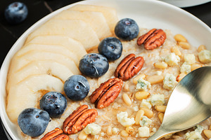 Oatmeal. Bowl of oatmeal porridge with blackberry, bananas and c, a Food & Drink Photo by Budarinphoto