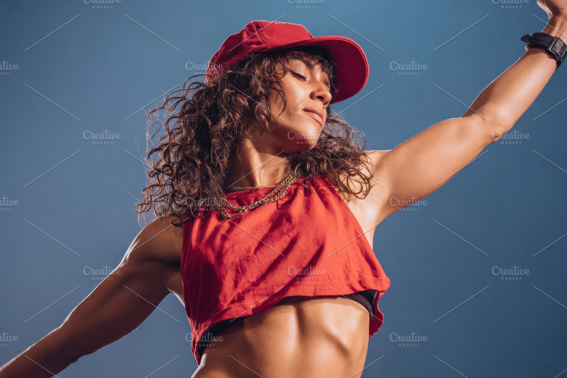 Confident dancer in red tracksuit performing, a Sports & Recreation Photo by AlyaAnd