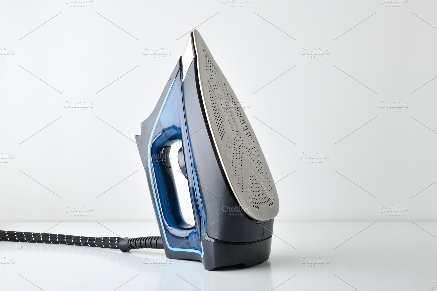 Steam iron supported vertically in a diagonal position, a Technology Photo by Davizro's Market