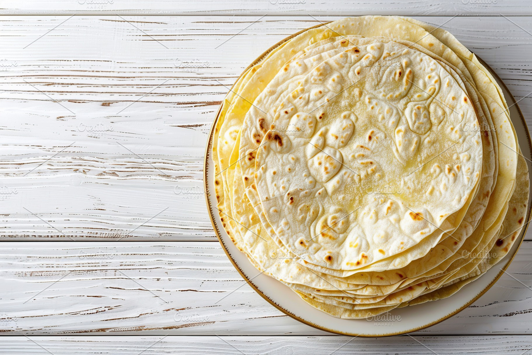 Flat lay of stack of corn tortillas on wooden table, a Food & Drink Photo by AlyaAnd