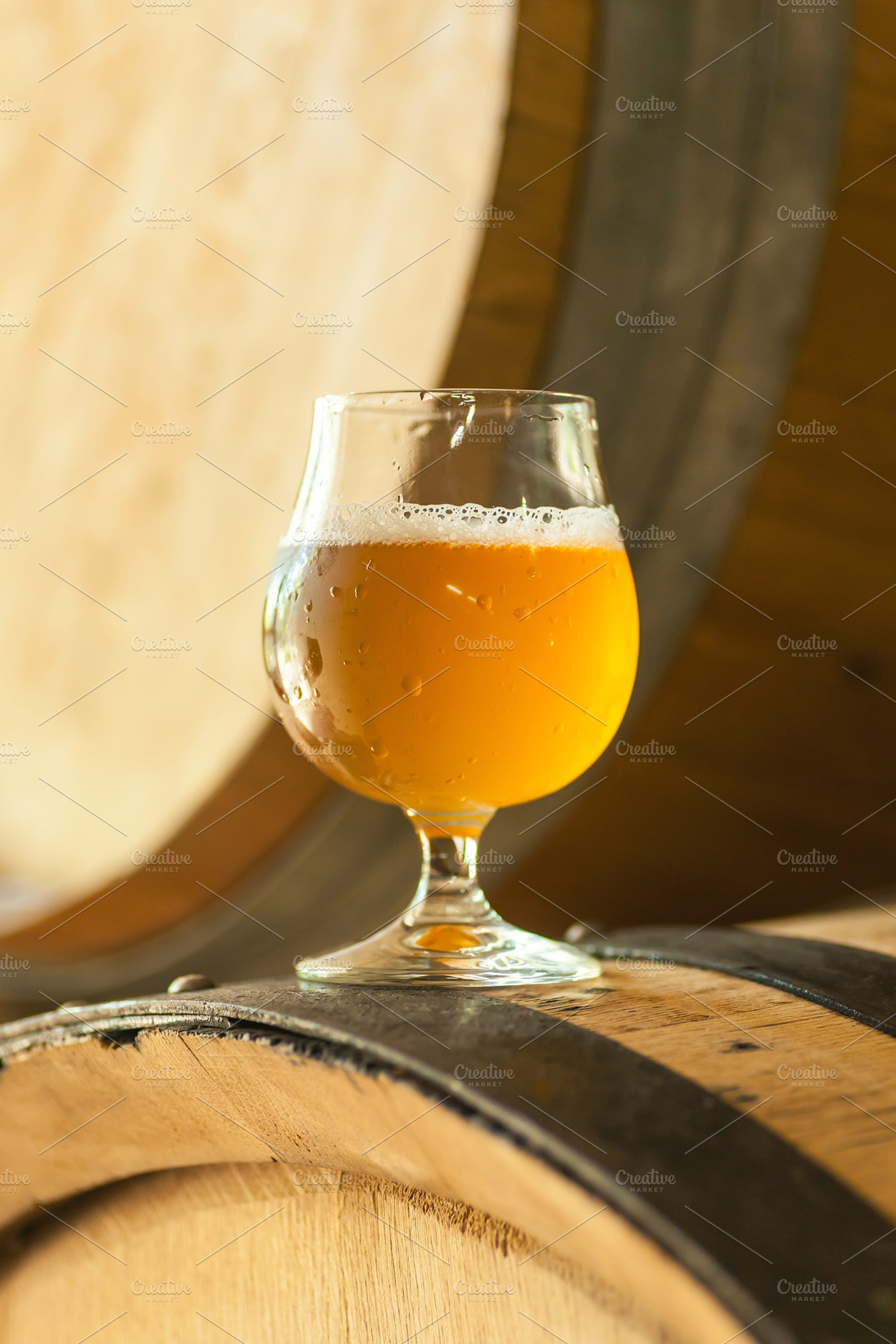 Light beer on a barrel featuring alcohol, ale, and amber, a Food & Drink Photo by Hidden Hallow