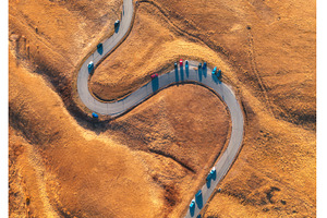 Aerial view of winding road in, a Nature Photo by den-belitsky