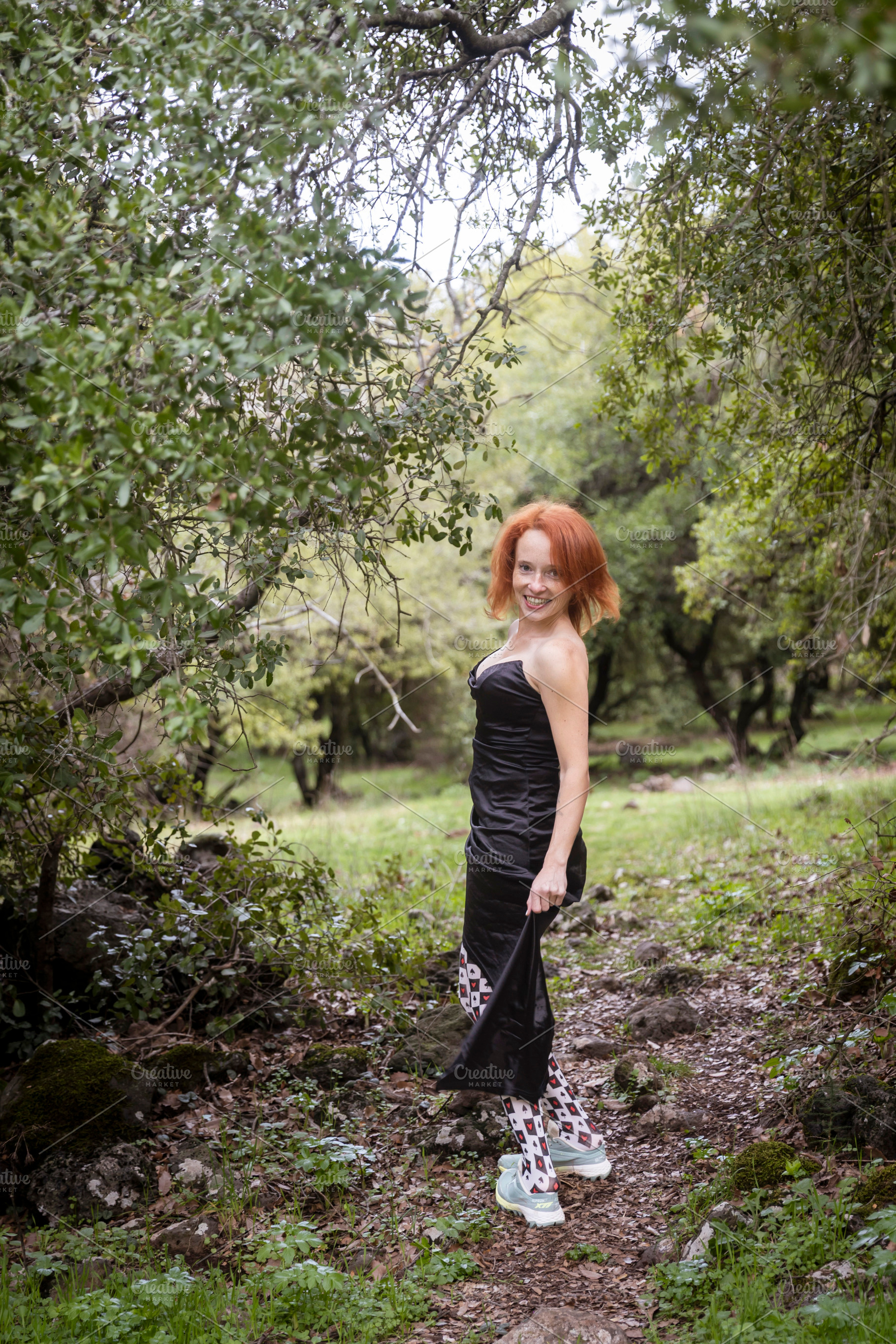 Red haired woman in a black dress an, a Person Photo by Imaginarium