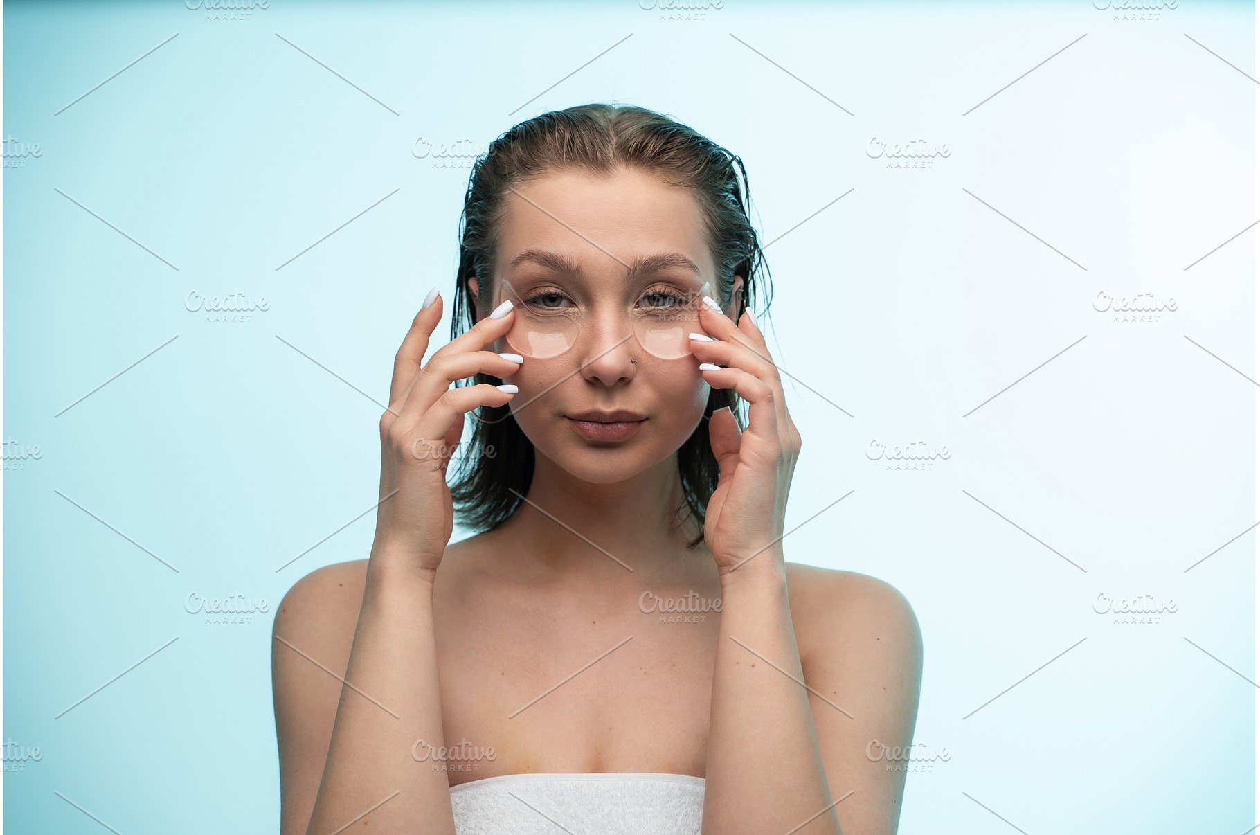 Woman applying under eye patches, a Person Photo by volodymyrshtun13795
