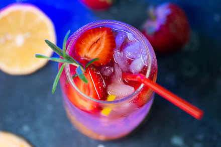 Refreshing summer strawberry mojito close-up on a black table with strawberry a, a Food & Drink Photo by PavelKant