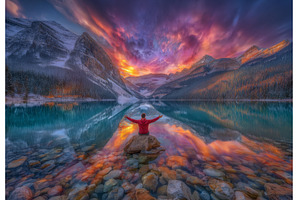 Seated on a rock, a man in a red, a Nature Photo by ZinetroN