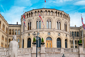 Norwegian Parliament beyond a garden lawn in Oslo, a Photo by Nito