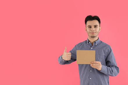 Attractive guy with space for text on pink background, a Person Photo by AtlasStudio PRO